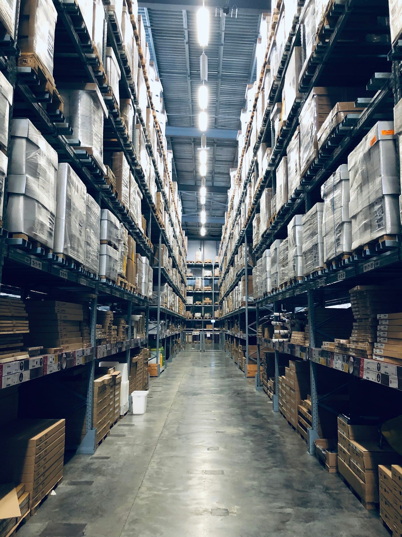 Aisle of stocked shelving in a fulfilment warehouse